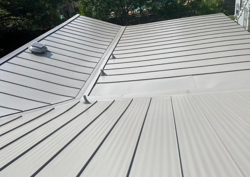 Solar attic fan installed on a metal roof for Roof Ventilation in Philomath